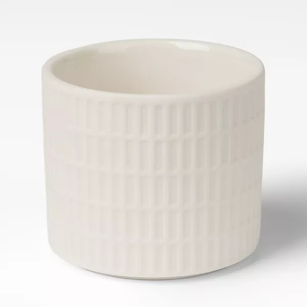 मिल्की व्हाईट ग्रिड-नमुनेदार सिरेमिक मेणबत्ती धारक मिल्की व्हाईट ग्रिड-नमुनेदार सिरेमिक मेणबत्ती धारक